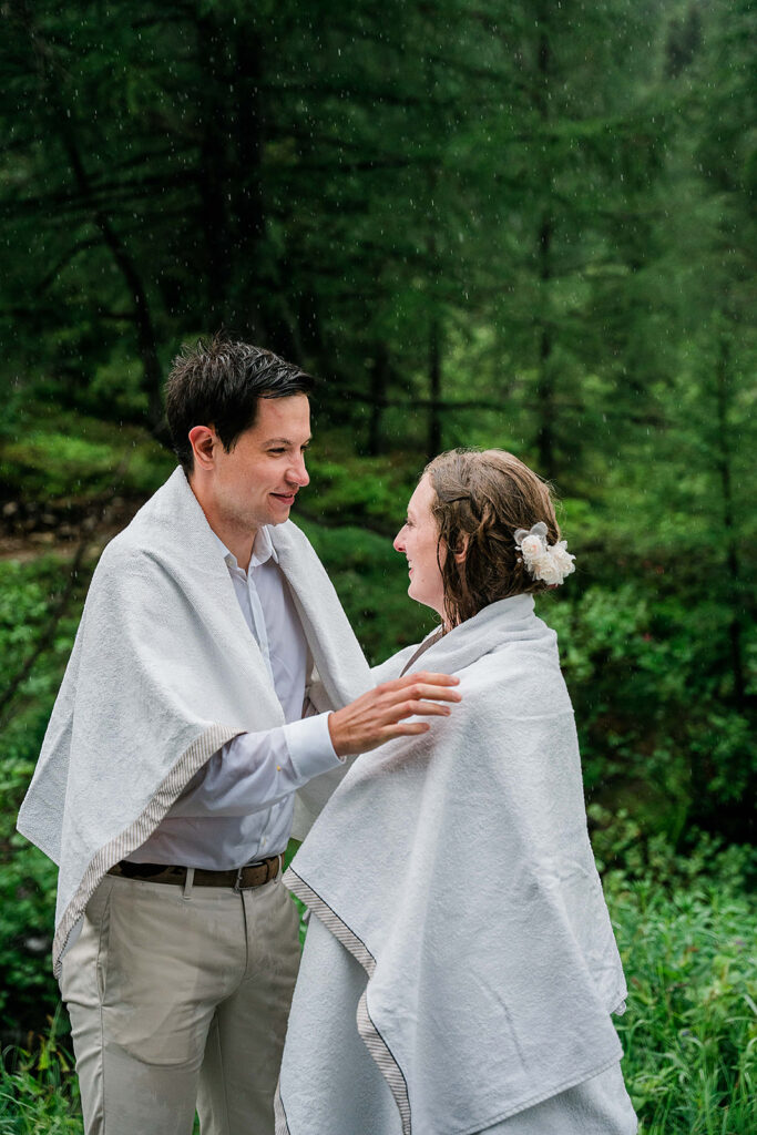 Bride and groom under the rain